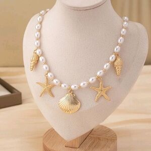 Elegant Gold and Pearl Shell Charm Necklace